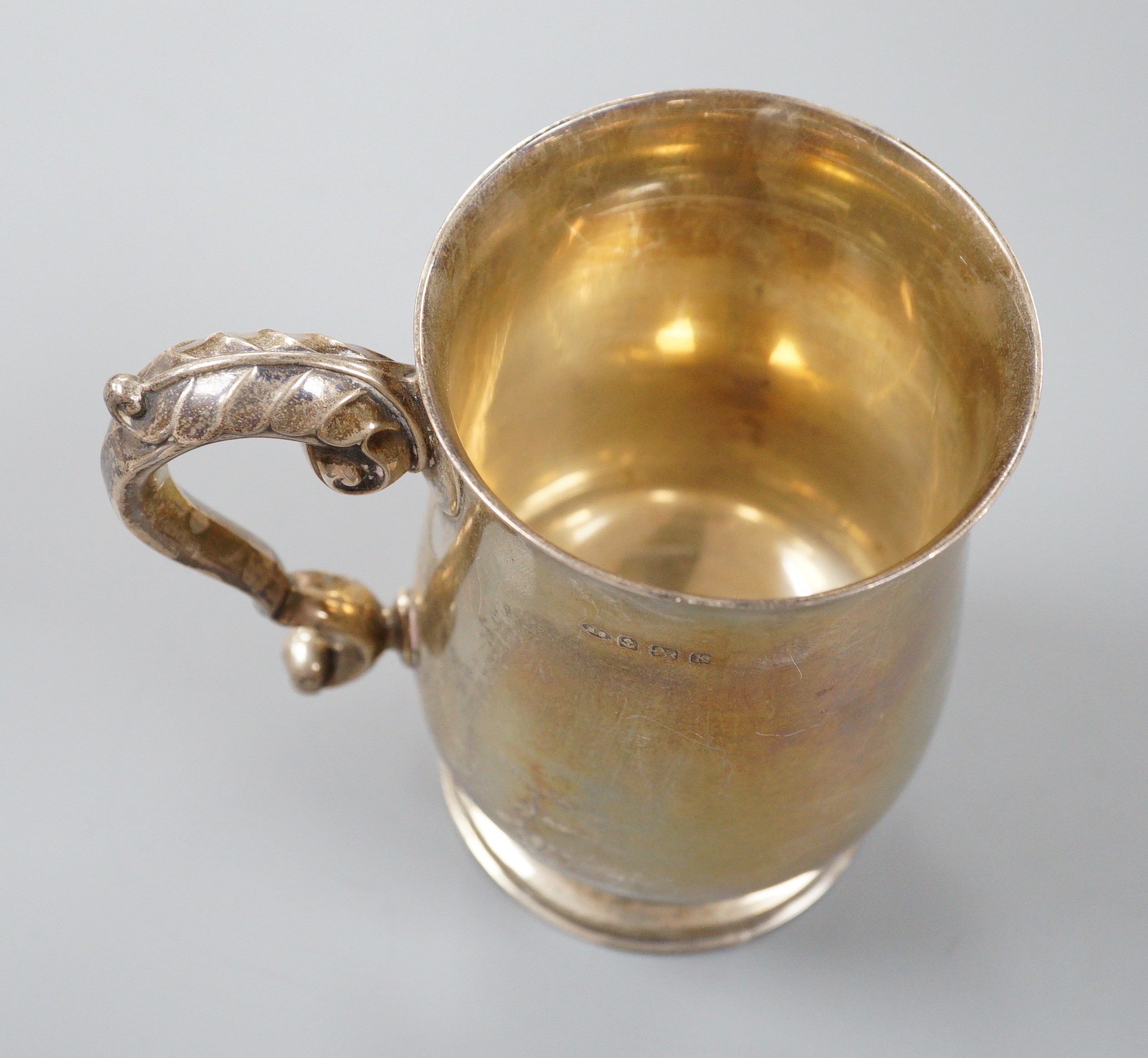 A George V silver baluster mug, Birmingham, 1934, 13.5cm, 14oz.